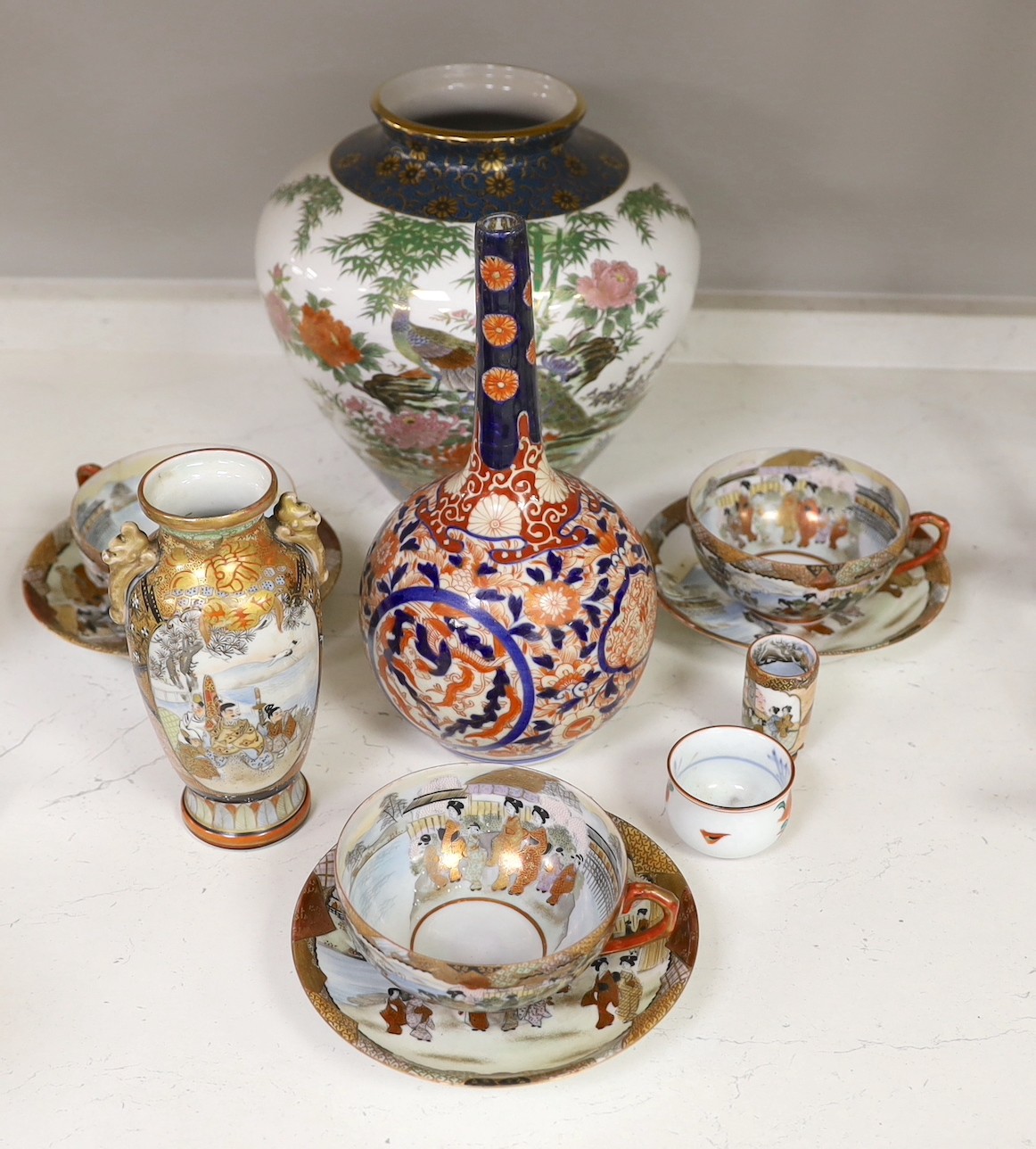 Assorted Japanese ceramics including an Imari bottle vase, a Satsuma vase and Kutani eggshell porcelain